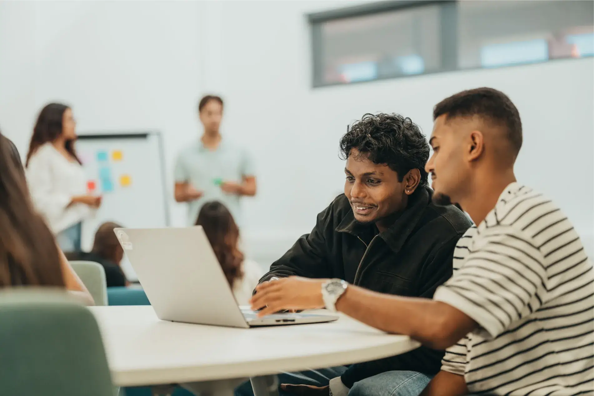 Two Middlesex University Mauritius students working together on a laptop during an employability workshop